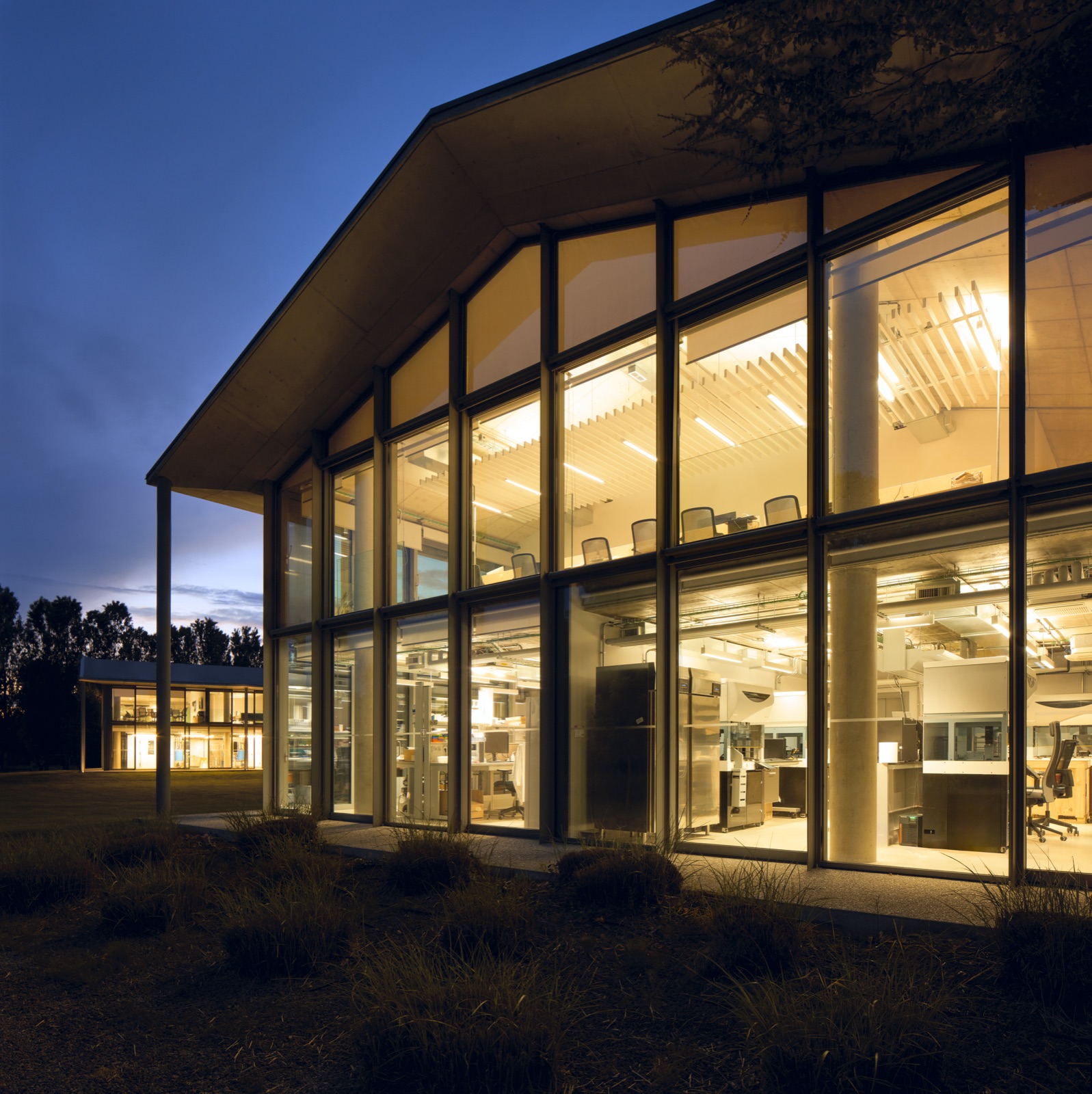 The glass headquarters at dusk